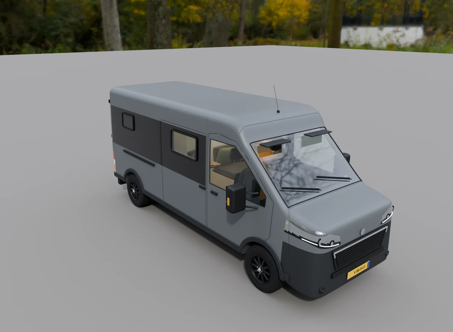 De grijze camper, schuin van voren bekeken